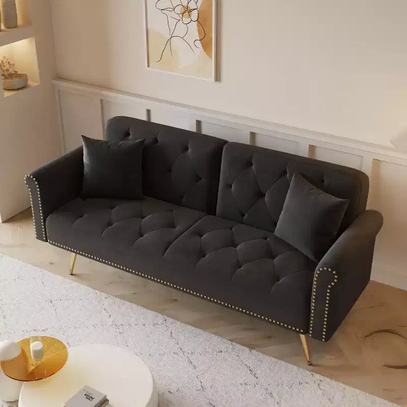 Black Velvet Fabric Sofa Featuring Nail Head Trim and Accompanied By A Matching Throw Pillow