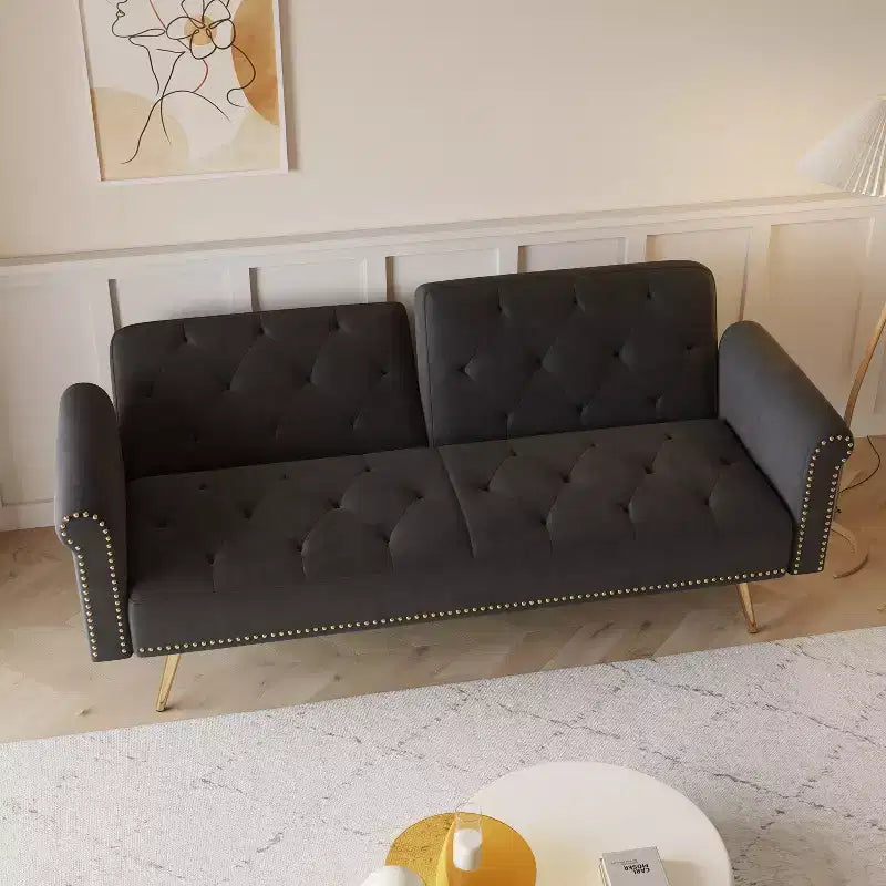 Black Velvet Fabric Sofa Featuring Nail Head Trim and Accompanied By A Matching Throw Pillow