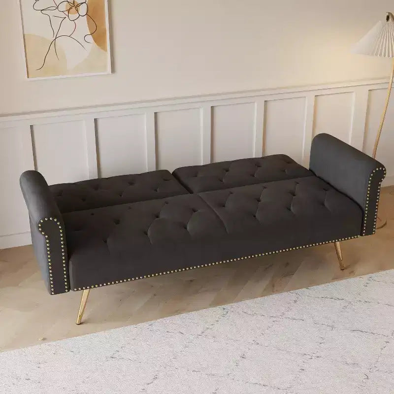 Black Velvet Fabric Sofa Featuring Nail Head Trim and Accompanied By A Matching Throw Pillow